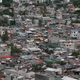 A poor residential district and squatter colonies are overlooked by high rise residential and commercial buildings in Taguig, Metro Manila.